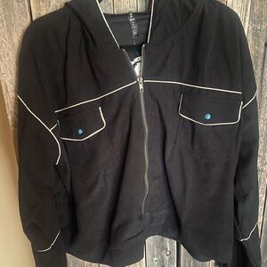 Black Jacket with White piping. corduroy with turquoise buttons. has hood